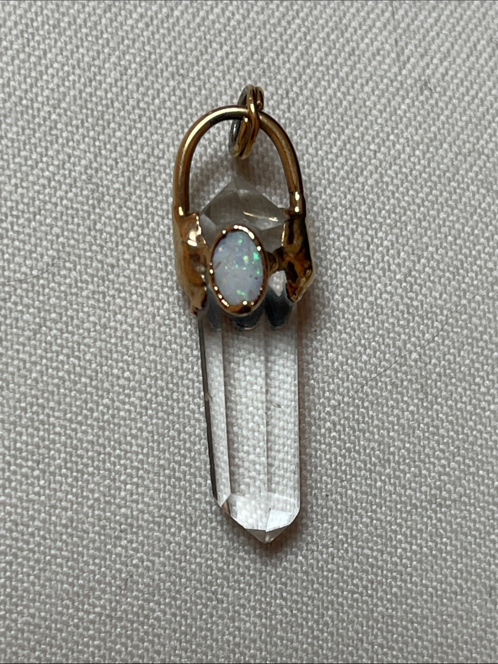 SOLD:  Dainty clear quartz point w/ opal embellishment capped w/ goldplated bale